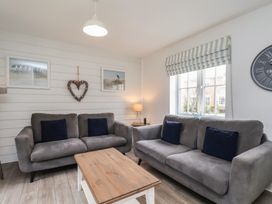 A living room with sofas and a coffee table at Coastal Cottage The Bay near Filey