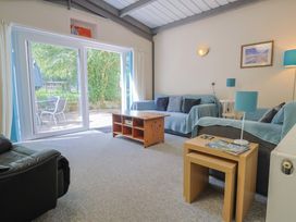 A living room with a sofa and coffee table at Brookfield Lodge in Drimpton