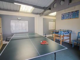 A games room with a table tennis table and foosball table at Brookfield Lodge Drimpton