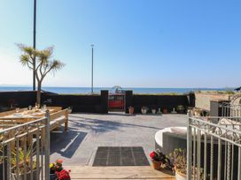 An outdoor area with a view of the ocean at Wavecrest in Pwllheli