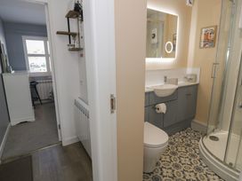 A bathroom with a shower and sink at Lan y Mor in Porthmadog