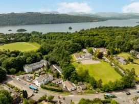 An aerial view of houses and a lake at Mylnebeck Lodge in Bowness-on-Windermere