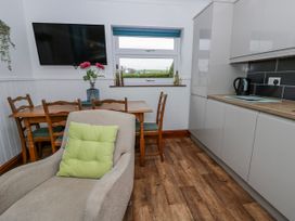 A kitchen with a table and two chairs at Blaenywawr near Lampeter