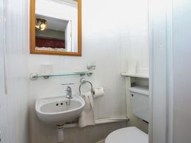 A bathroom with a sink and toilet at Maesawel Studio in Llanfair