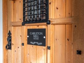 A door with a nameplate at Carleton Mill Cottage in Carlisle