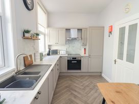 A kitchen with cabinets and appliances at St Johns View in Keswick