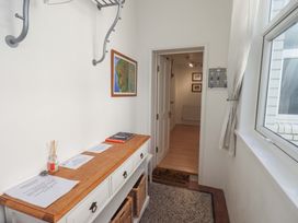 A hallway with a table and coatrack at St Johns View in Keswick