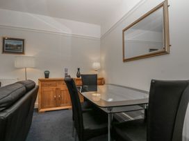 A dining room with a table and chairs at Amba in Keswick