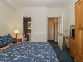 A bedroom with a bed and nightstand at Amba in Keswick