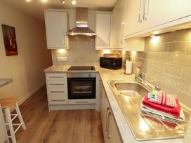 A kitchen with stove and sink at Archers in Keswick