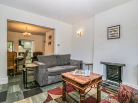 A living room with a sofa and coffee table at Fountain Cottage in Keswick