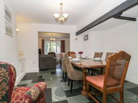 A dining room with a table and chairs at Fountain Cottage in Keswick