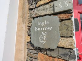 A house sign displaying 'Ingle Burrow' at number 33 in Windermere