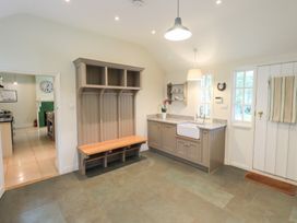 A kitchen with a sink and a bench at Little Ellers in Portinscale near Keswick