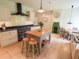 A kitchen with an island and oven at Little Ellers in Portinscale near Keswick