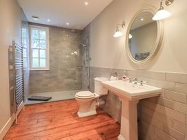 A bathroom with a shower and sink at Little Ellers Portinscale near Keswick