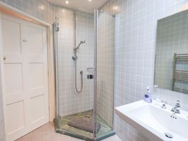 A bathroom with a shower and sink at Little Ellers in Portinscale near Keswick