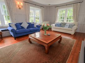 A living room with sofas and a coffee table at Little Ellers in Portinscale near Keswick