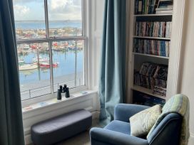 A living room with a view of the harbor at Westcliff Newlyn