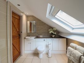 A bathroom with a sink and toilet at Cefn Uchaf Cottage Llanbedr