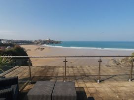 A balcony overlooking the sea and sandy beach at The View in Newquay