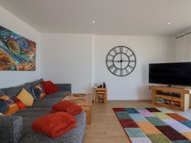 A living room with a sofa and a television at The View in Newquay
