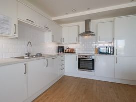 A kitchen with cabinets and appliances at The View in Newquay