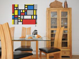 A dining room with a table and chairs at The View in Newquay