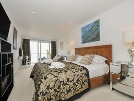 A bedroom with a bed and television at The View in Newquay