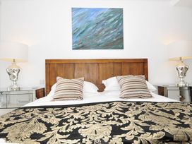 A bedroom with a bed and lamp at The View in Newquay
