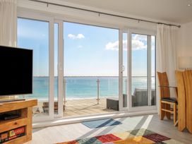 A living room with a view of the ocean at The View in Newquay