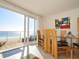 A dining area with a view of the sea at The View in Newquay