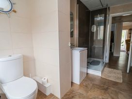 A bathroom with a sink, shower, and toilet at Riverlea Dyserth