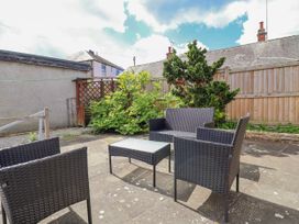 A patio with furniture at Riverlea in Dyserth