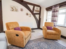 A living room with two recliner chairs and a window at Ty Cerrig in Dyserth