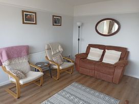 A living room with two armchairs and a brown sofa at Dubrovnik