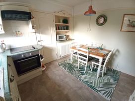 A kitchen with a dining table and chairs at Dubrovnik