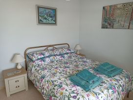 A bedroom with a bed and bedside table at Dubrovnik