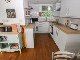 A kitchen with a sink and appliances at Driftwood in Roch