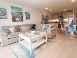 A living room with a sofa and coffee table at Ocean Seven in Newquay