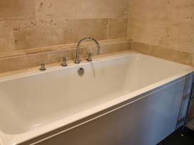 A bathtub with a faucet in a bathroom at Boavista in Carnforth