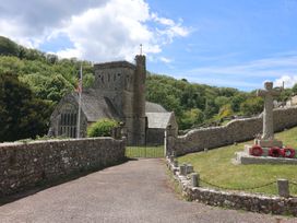 A church with a memorial and flag in Branscombe at Pottery Barn
