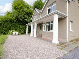 An outdoor area with seating and gravel at Coedfryn in Betws-y-Coed