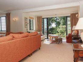 A living room with a sofa and coffee table at Sandsgate near Spinster's Rock, near Chagford