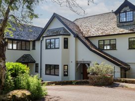 A view of a house exterior with pathways and garden at Sandsgate near Chagford