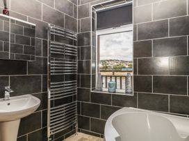A bathroom with a sink and bathtub at The Dolphins in Shaldon