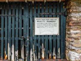 A gate with a sign for a private fishery at Sandridge Boathouse Stoke Gabriel