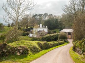 A house and garage on a driveway at Sandridge Barton Stoke Gabriel