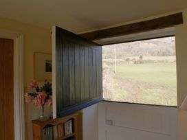 An open door with a view of fields at The Barn in Compton Bishop, near Cheddar