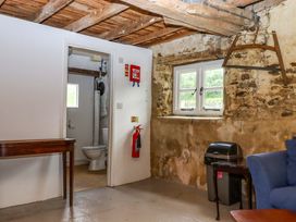 A bathroom with toilet and sink at Hornshayne Farmhouse Farway, near Honiton